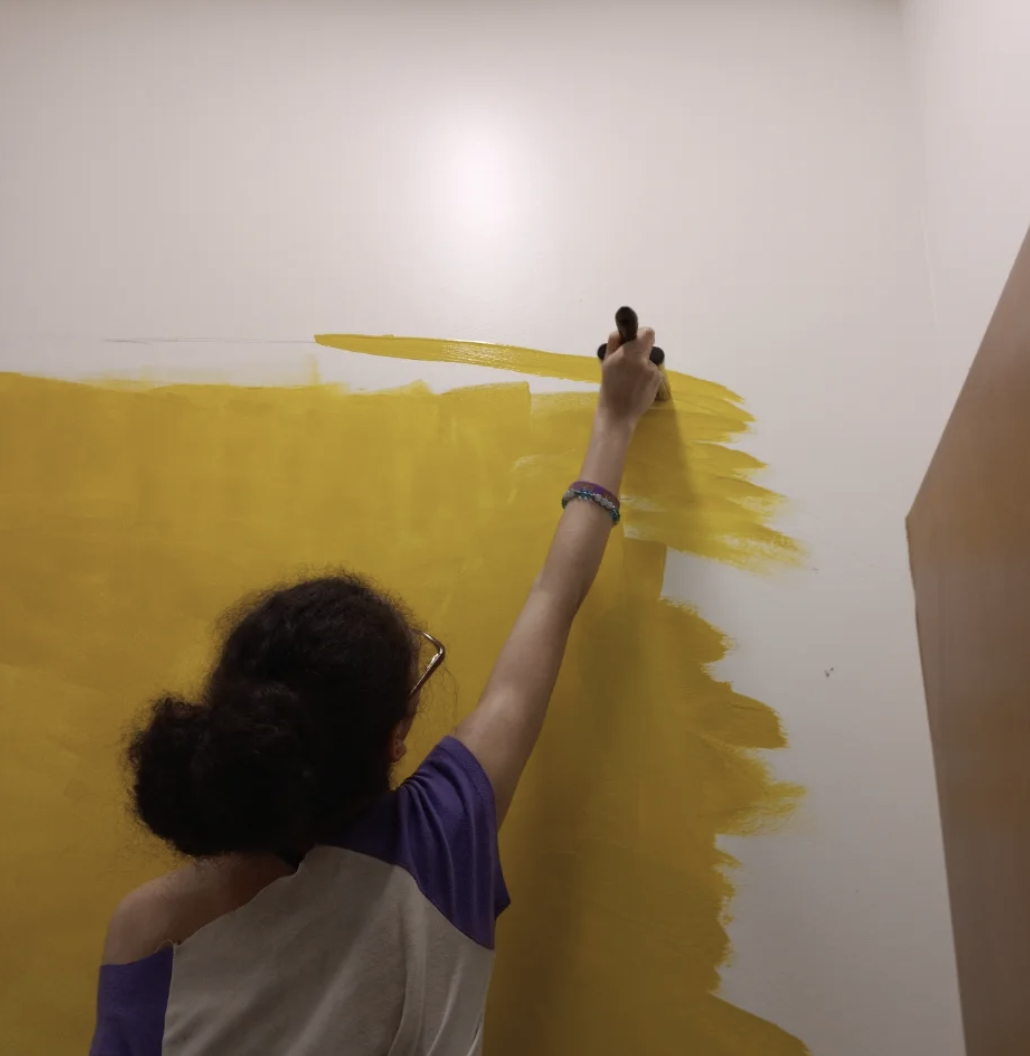 Ava Novick (12) painting the mural for the Spartanburg High School Volleyball team.